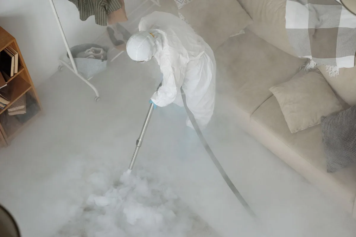 Biohazard cleanup technician in protective equipment, Ivanhoe, TX